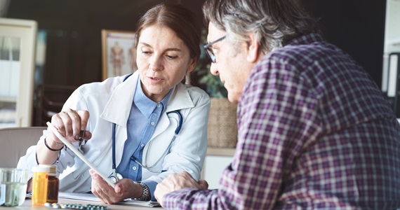 Doctor counseling patient at a desk